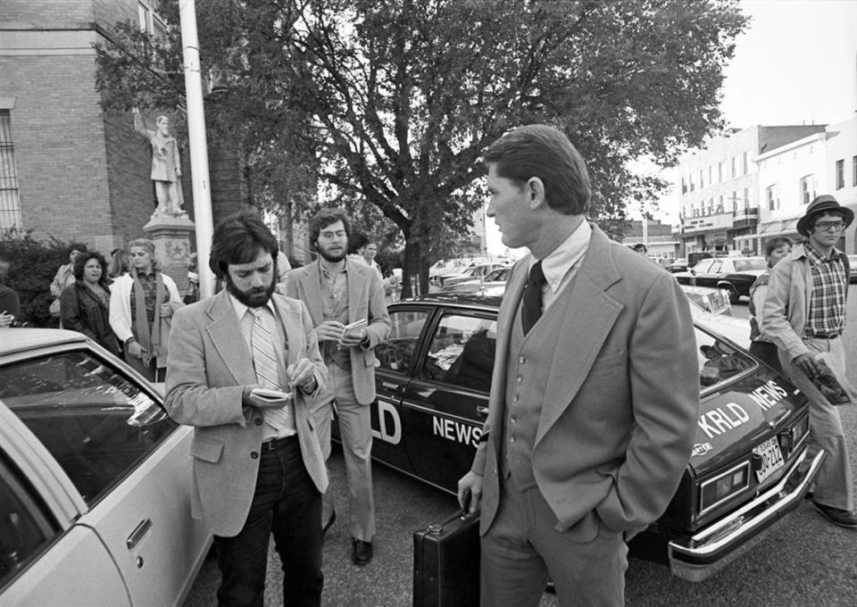 Members of the press gather around defense attorney Don Crowder outside of the old Collin County Courthouse after a jury acquitted Candace Montgomery.