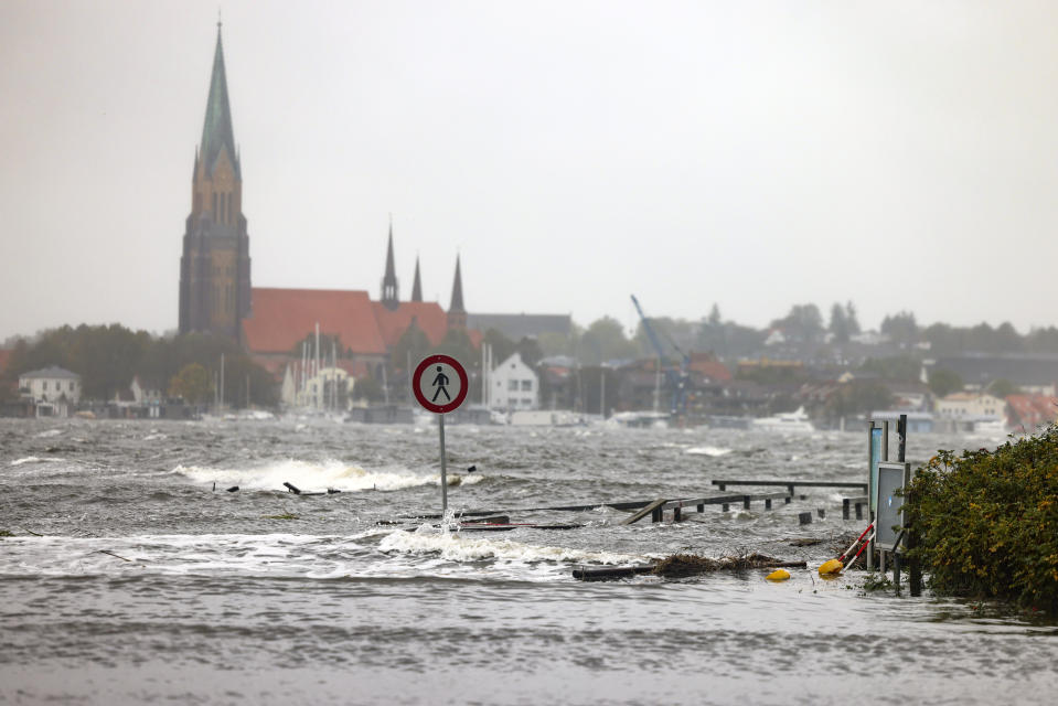 The water from the Schlei floods a boat harbor in Schleswig, Germany, Friday Oct. 20, 2023. Due to a storm low, the first streets and shore areas on the Baltic Sea coast have been flooded by high water. (Frank Molter/dpa via AP)