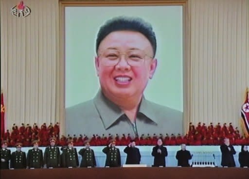 A screen grab from North Korea's state TV shows the picture of late leader Kim Jong-Il at Pyongyang's Kumsusan Memorial Palace during a military parade in February. North Korea held a national memorial service on Sunday to mark the 100th day since Kim's death, hailing the country's nuclear weapons programme as his outstanding feat