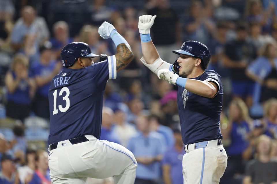 Kansas City Royals' Salvador Perez (13) congratulates Vinnie Pasquantino, right, for a two-run home run against the Cleveland Guardians during the eighth inning of a baseball game in Kansas City, Mo., Friday, June 28, 2024. (AP Photo/Colin E. Braley)