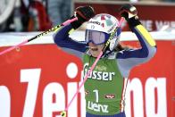 Italy's Marta Bassino celebrates her second place in an alpine ski, women's World Cup giant slalom, in Lienz, Austria, Saturday, Dec. 28, 2019. (AP Photo/Piermarco Tacca)