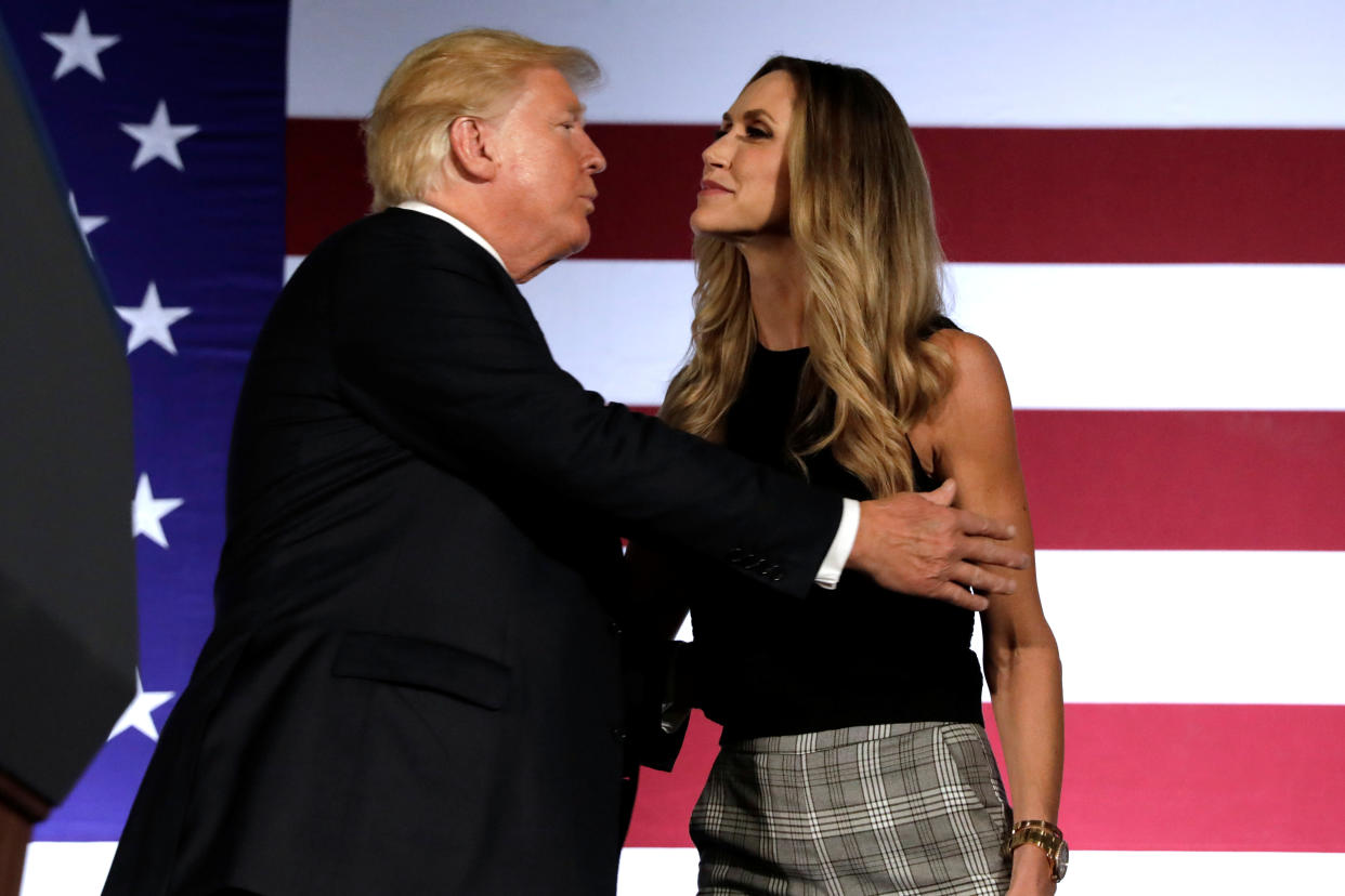 U.S. President Donald Trump kisses his daughter-in-law Lara Trump at campaign fundraising luncheon for Rep. Ted Budd (R-NC) and GOP congressional candidate Mark Harris at Carmel Country Club in Charlotte, NC, U.S., August 31, 2018. REUTERS/Yuri Gripas