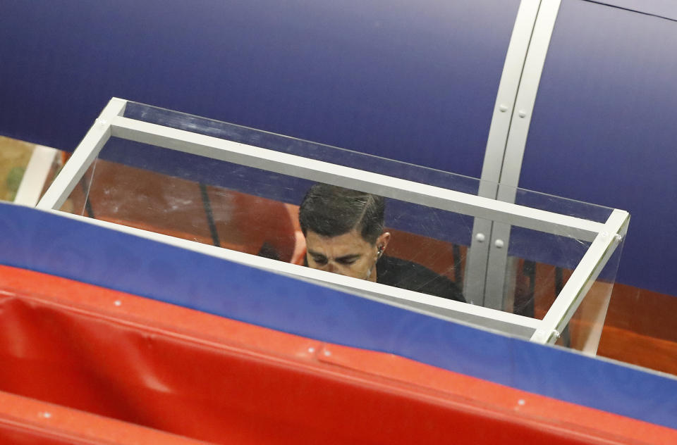 Referee Enrique Caceres watches the VAR during the controversial Group B match between Iran and Portugal