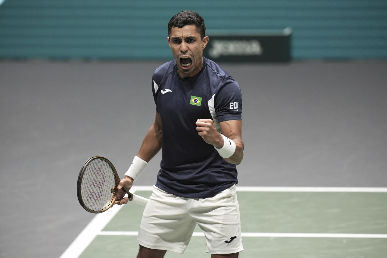 Brazil's Thiago Monteiro reacts as he play Belgium's Zizou Bergs during their Davis Cup tennis match at the Unipol Arena, in Bologna, Italy, Sept. 14, 2024. ( Massimo Paolone/LaPresse via AP)