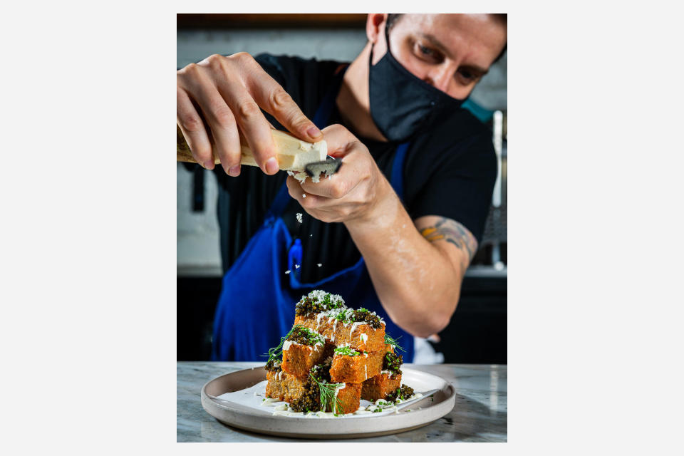 <div class="cell medium-auto caption">Chef Conroy preparing duck fat-fried potatoes with caviar</div> <div class="cell medium-shrink medium-text-right credit">Rey Lopez</div>