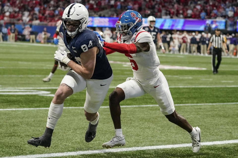 Penn State tight end Theo Johnson (84) runs into the end zone for a touchdown against Mississippi cornerback Zamari Walton (6) during the first half of the Peach Bowl NCAA college football game, Saturday, Dec. 30, 2023, in Atlanta. (AP Photo/Brynn Anderson)