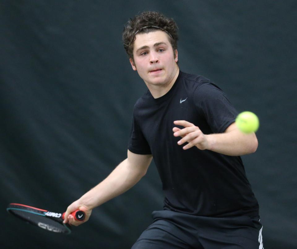 Cade VanNatta of Hoover returns a volley during his no. 1 doubles match against Wyatt Greenlees and Ethan Vukovic of Wadsworth at the Hall of Fame Fitness Center on Tuesday, March 29, 2022. VanNatta's partner is Kyle Fitz-Patrick.