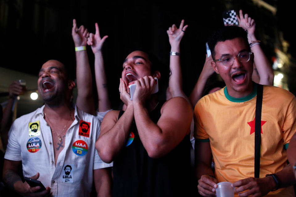 Supporters of Luiz Inácio Lula da Silva of Workers' Party cheer for their candidate during vote count in Largo Da Prainha area on presidential runoff day on Oct. 30, 2022 in Rio de Janeiro, Brazil.<span class="copyright">Joao Laet—Getty Images</span>