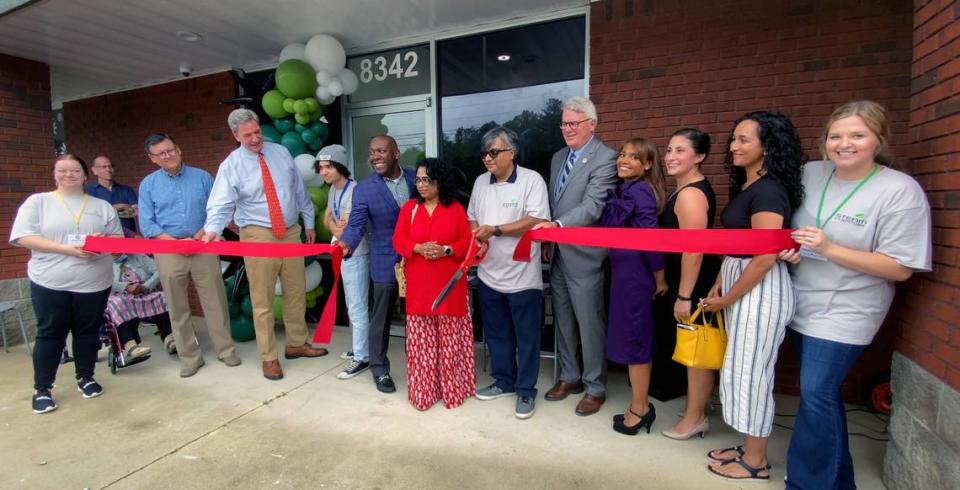 Aryya Bhattacharyya, CEO of STEAM Inventors, holding scissors, center, cuts the ribbon at his new Columbus business Wednesday afternoon. 06/22/2023