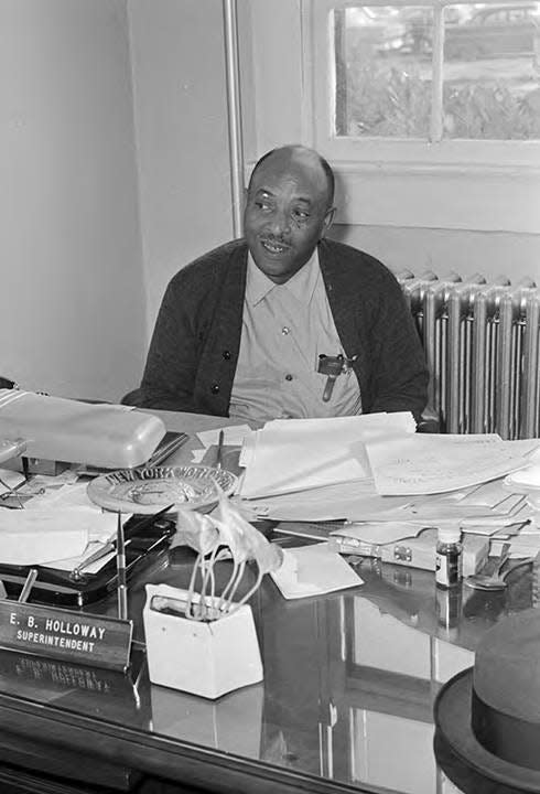 E.B. Holloway, superintendent of the Alabama Industrial School for Negro Children, sits behind his desk in this photo by Haywood Paravicini from 1965.