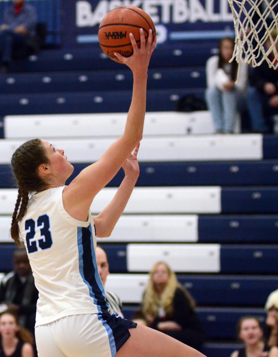 Petoskey's Caroline Guy finishes off a drive with a layup against Lake City Saturday.