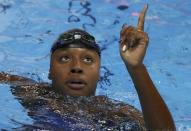 2016 Rio Olympics - Swimming - Final - Women's 100m Freestyle Final - Olympic Aquatics Stadium - Rio de Janeiro, Brazil - 11/08/2016. Simone Manuel (USA) of USA reacts after winning the gold and setting a new Olympic record. REUTERS/Marcos Brindicci