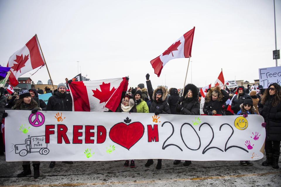 <p>Protestors show their support for the Freedom Convoy of truck drivers who are making their way to Ottawa to protest against COVID-19 vaccine mandates by the Canadian government on Thursday, Jan. 27, 2022, in Vaughan. (Photo by Arthur Mola/Invision/AP)</p> 