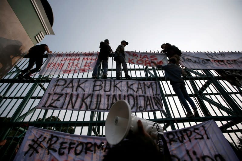 FILE PHOTO: University students protest outside the Indonesian Parliament in Jakarta