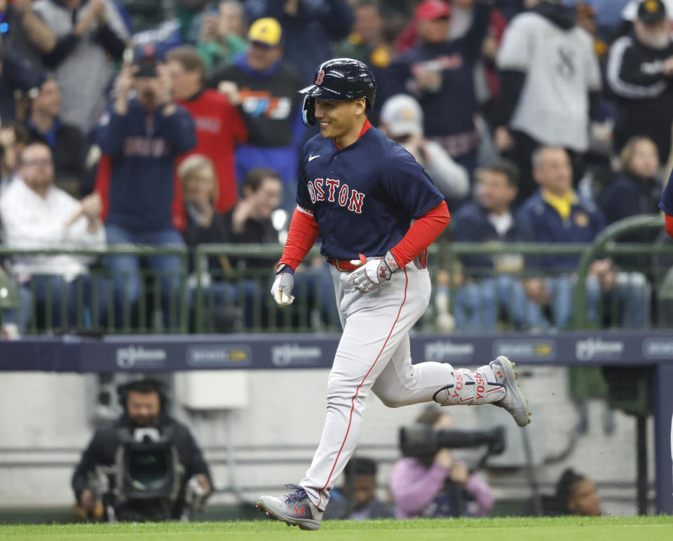 Boston Red Sox's Masataka Yoshida rounds the bases after his grand slam against the Milwaukee Brewers during the eighth inning of a baseball game Sunday, April 23, 2023, in Milwaukee. (AP Photo/Jeffrey Phelps)