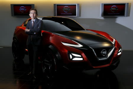 Shiro Nakamura, Senior Vice President and Chief Creative Officer of Nissan Motor Co, poses for a photo with Nissan Gripz concept car at the company's Global Design Center in Atsugi, Japan, April 14, 2016. REUTERS/Toru Hanai