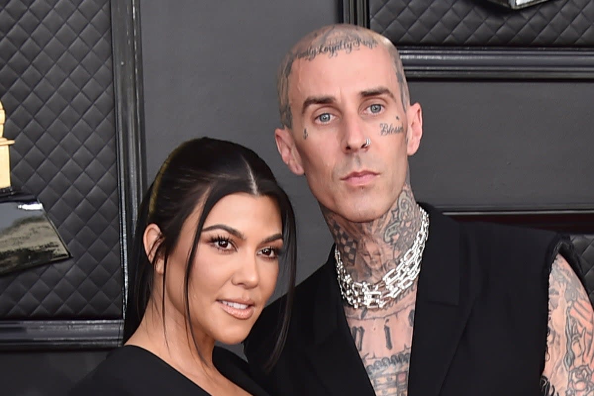 Pregnant Kourtney Kardashian and Travis Barker picured in April 2023 (Jordan Strauss/Invision/AP)