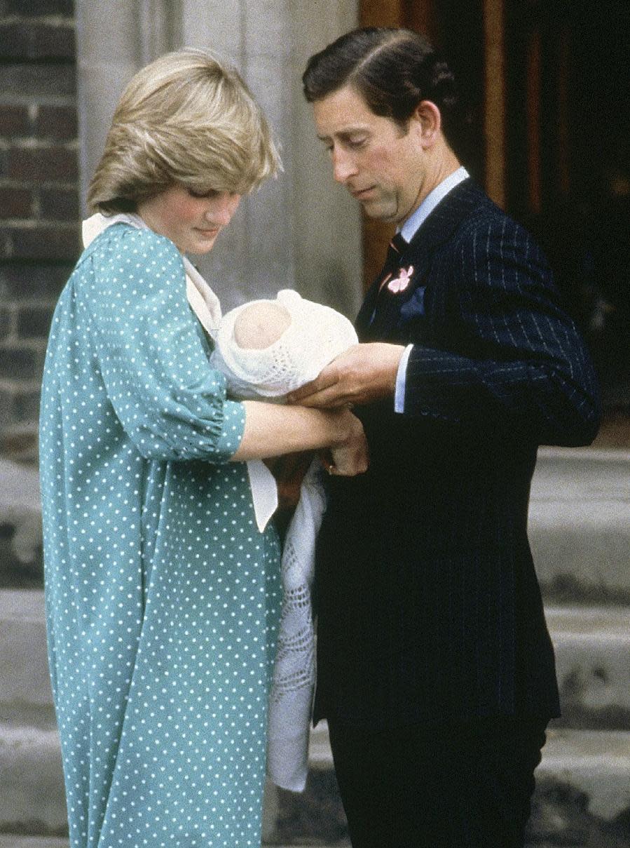 FILE - In this June 22, 1982, file photo, Britain's Prince Charles, Prince of Wales, and wife Princess Diana take home their newborn son Prince William, as they leave St. Mary's Hospital in London. Princess Diana’s caftan-like outfit hid the post-childbirth tummy bump that is normal for any new mom. In contrast, the former Kate Middleton, in her first public appearance on July 23, 2013, after giving birth, wore a dress that did not camouflage her belly, and many women are applauding her choice. (AP Photo/John Redman, File)