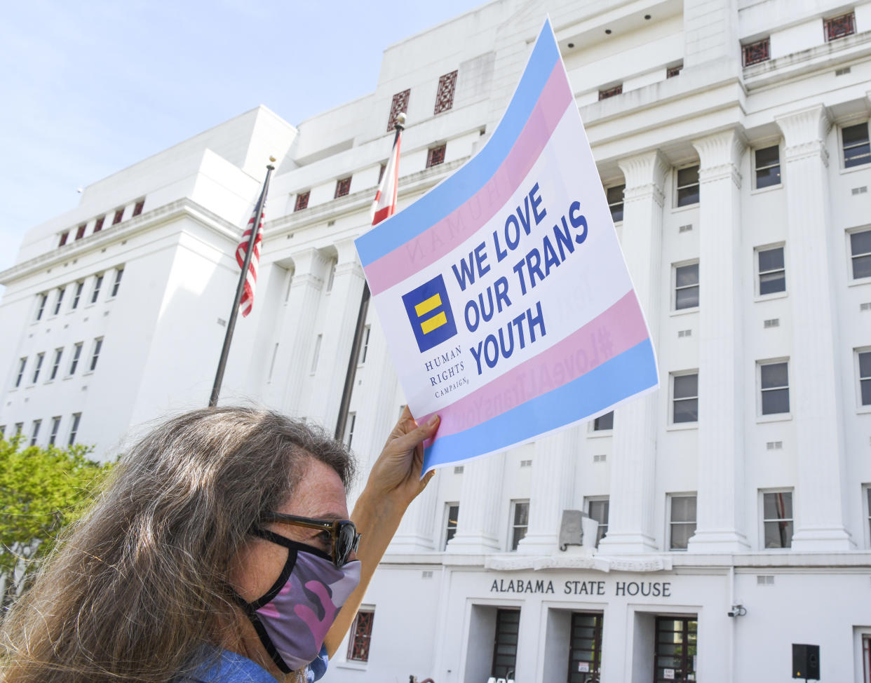 A protestor at the Alabama State House in March drew attention to anti-trans legislation that would make it a crime for doctors to provide gender-affirming healthcare to transgender youth. (Photo: Julie Bennett/Getty Images)