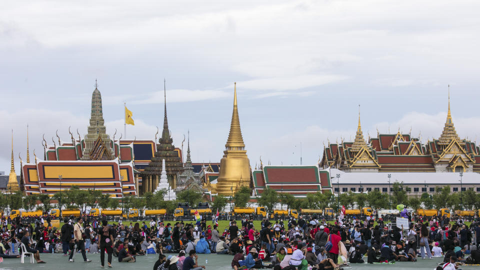 Pro-democracy protesters gather at the Sanam Luang field during a protest in Bangkok, Thailand, Sunday, Sept. 20, 2020. Thousands of demonstrators turned out Saturday for a rally to support the student-led protest movement's demands for new elections and reform of the monarchy. (AP Photo/Wason Wanichakorn)