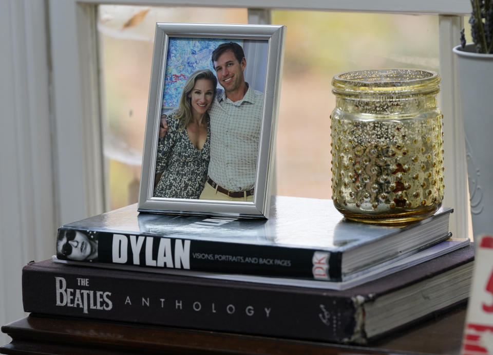 A photo of Nurse Practitioner and former Democratic candidate for the Virginia House of Delegates, Susanna Gibson, and her husband is displayed during an interview at her home Wednesday Nov. 15, 2023, in Henrico, Va. (AP Photo/Steve Helber)