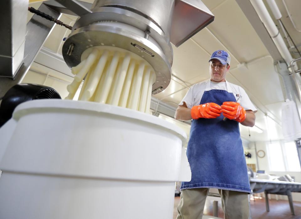 Jon Metzig, carrying on the family business, makes string cheese at Union Star Cheese Factory on May 23, 2023, in Zittau Wis.