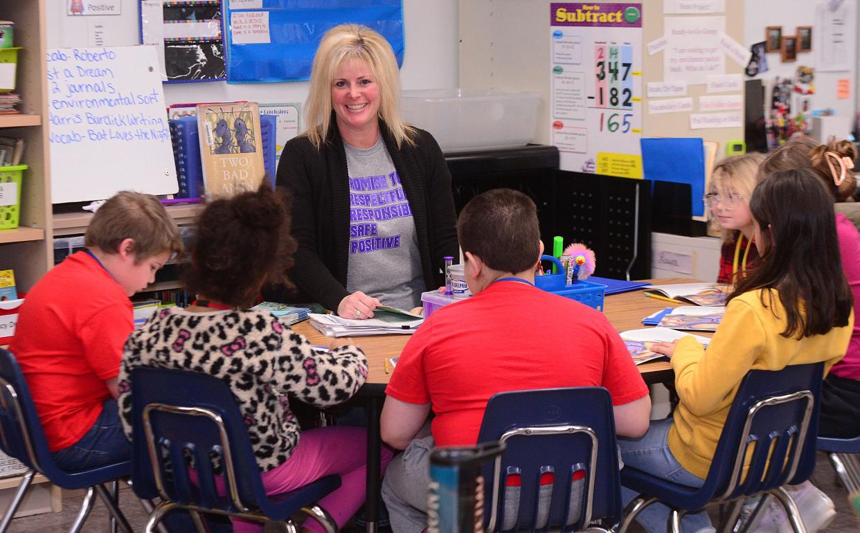 B.L. Miller third-grade teacher Leann Laure works with her students Wednesday, Jan. 10, 2024, in her classroom. Laure is The Alliance Review's Robertson Kitchen & Bath Teacher of the Month for January.