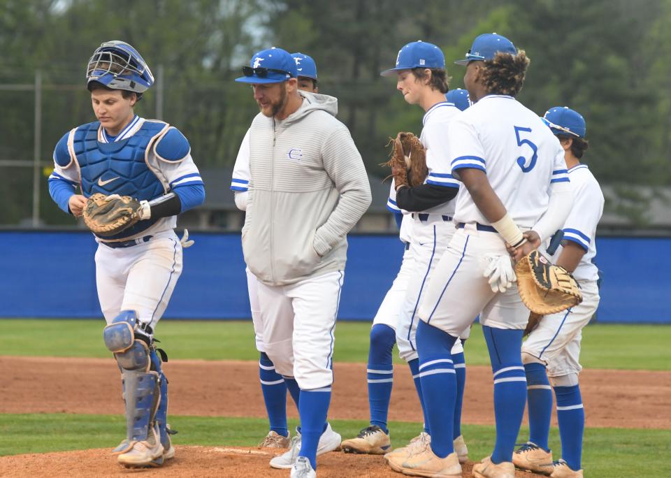 Etowah coach Blake Bone (middle) has a conference with his players on the mound during a high school baseball game Friday, April 8, 2022 in Attalla, Alabama. Ehsan Kassim/Gadsden Times.