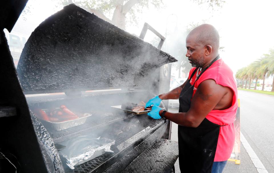 Beach Brothers BBQ food truck owner Lloyd Peoples prepares a brisket Wednesday afternoon, June 10, 2020 while stationed along Cape Coral Parkway in front of No.3 Craft Brews & Beer Bar. Peoples said that he's seen more customers and an increase in online support in recent days.