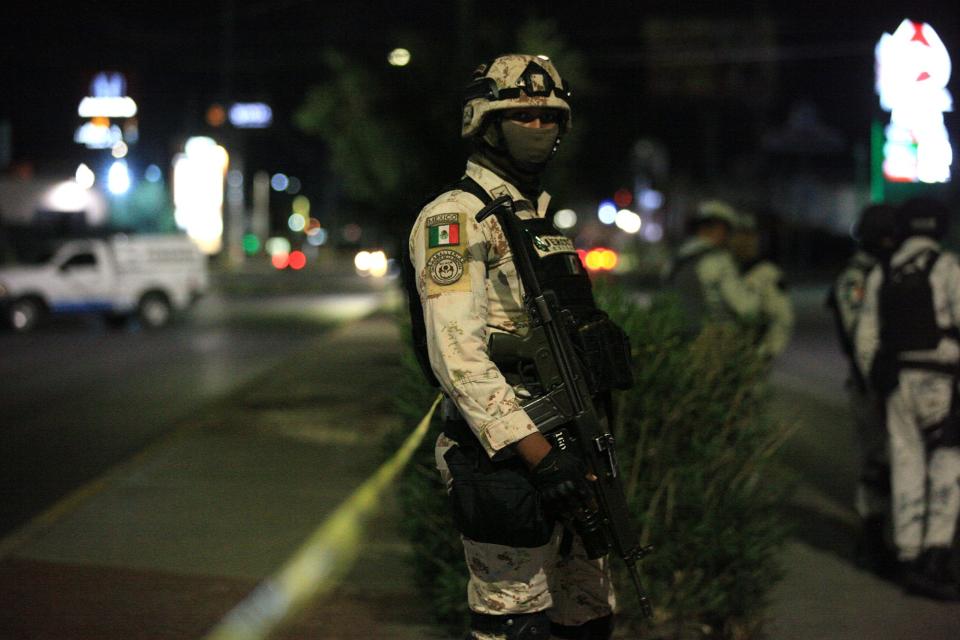 A Mexican army soldier stands watch after a deadly rash of drug-related shootings in Juárez, Mexico, in 2022.