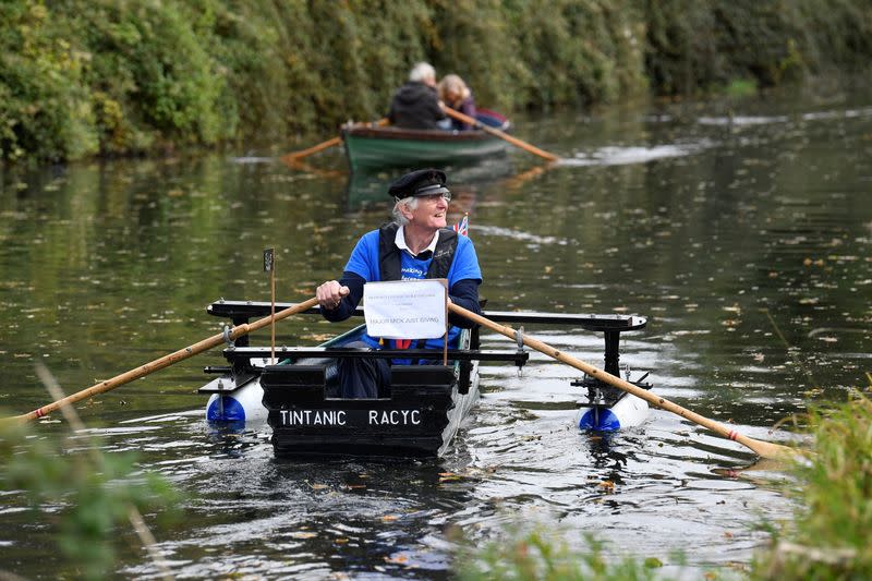 80-year old military veteran Stanley rows homemade boat named the "Tintanic" to raise funds for charity St Wilfrid's Hospice, in Chichester