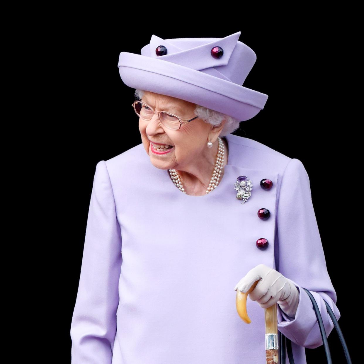  Queen Elizabeth in a lavender outfit 