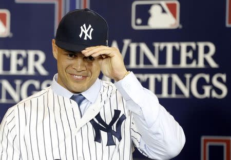 Dec 11, 2017; Orlando, FL, USA; New York Yankees outfielder Giancarlo Stanton (27) is interview by MLB network during the winter meetings at Walt Disney World Swan and Dolphin Resort. Mandatory Credit: Kim Klement-USA TODAY Sports