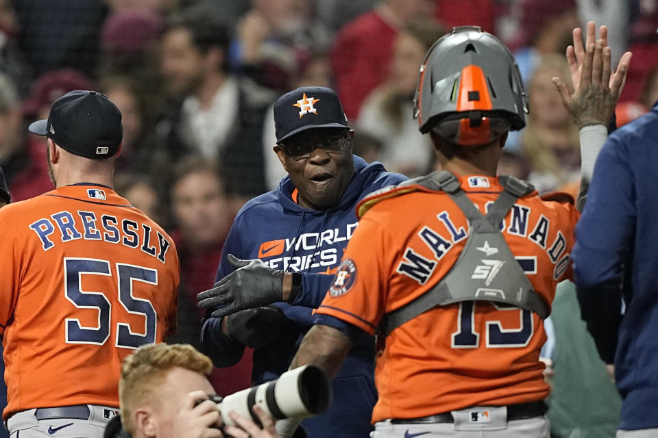 Houston Astros manager Dusty Baker Jr. and catcher Martin Maldonado celebrate their win in Game 5 of baseball's World Series between the Houston Astros and the Philadelphia Phillies on Friday, Nov. 4, 2022, in Philadelphia. The Astros won 3-2, to take a one game lead in the best of seven series. (AP Photo/David J. Phillip)