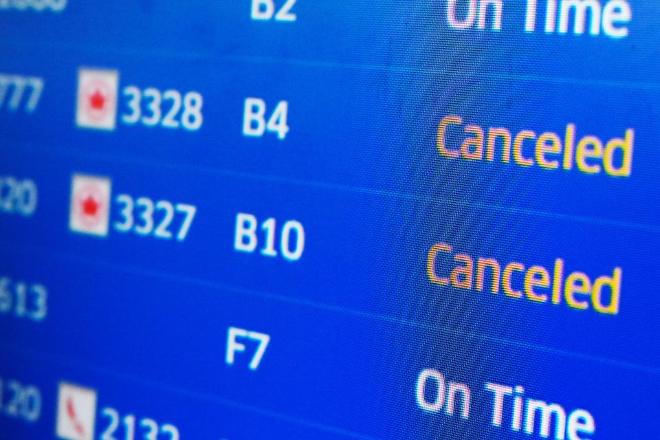 A flight information screen displays canceled flights at O'Hare International Airport in Chicago, on Jan. 14, 2024.