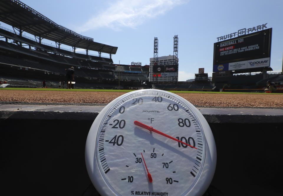 Temperature shows over 100 degrees before a baseball game between the Atlanta Braves and San Francisco Giants at Truist Park in Atlanta, Thursday, June 23, 2022. A heat wave that's already lasted more than a week keeps on baking the US, Asia, Europe and even the Arctic. (Curtis Compton/Atlanta Journal-Constitution via AP)