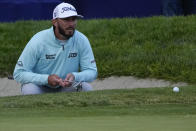 Max Homa prepares to putt on the 18th hole of the South Course at Torrey Pines during the final round of the Farmers Insurance Open golf tournament, Saturday, Jan. 28, 2023, in San Diego. (AP Photo/Gregory Bull)