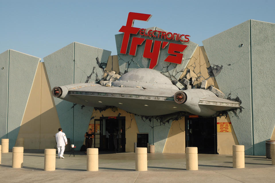 the fry's electronics in burbank with a crashed ufo sticking out of it