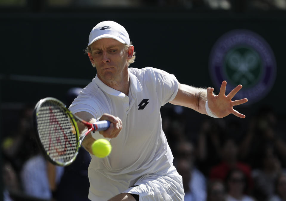 South Africa’s Kevin Anderson returns the ball to Serbia’s Novak Djokovic during the men’s singles final match at the Wimbledon Tennis Championships in London, Sunday July 15, 2018. (AP Photo/Ben Curtis)