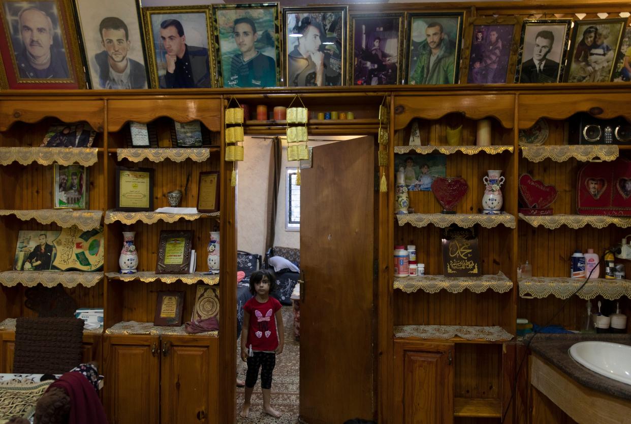 Palestinians Grieving Family (Copyright 2021 The Associated Press. All rights reserved)