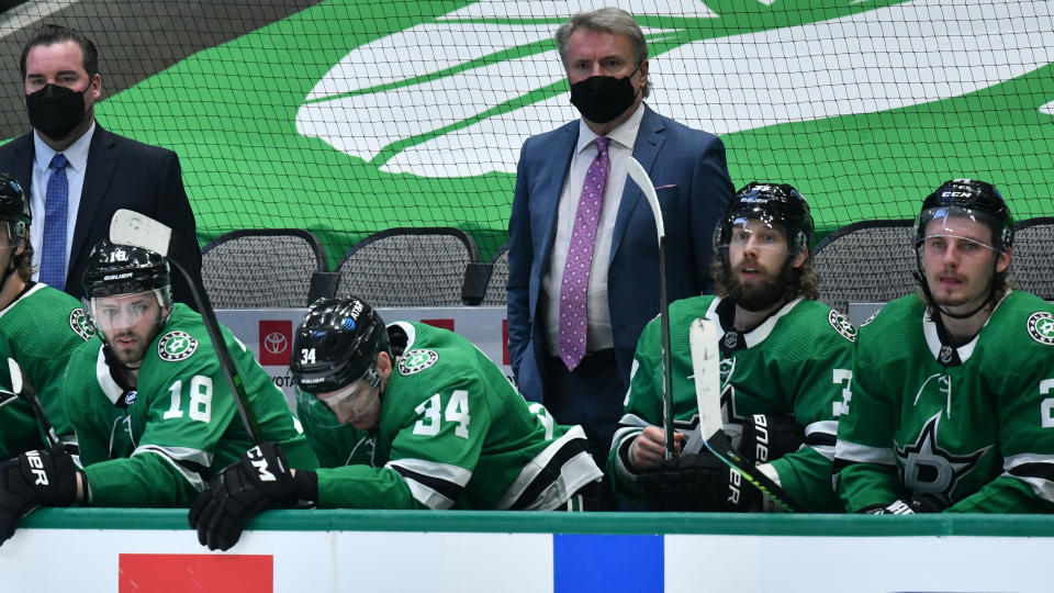 DALLAS, TX - MARCH 25: Rick Bowness of the Dallas Stars watches the action from behind the bench against the Tampa Bay Lightning at the American Airlines Center on March 25, 2021 in Dallas, Texas. (Photo by Glenn James/NHLI via Getty Images)