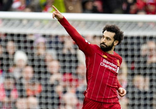 <span class="caption">Liverpool's Mohamed Salah celebrates after scoring during a match between Liverpool and Bournemouth in early March, 2020</span> <span class="attribution"><a class="link " href="https://webgate.epa.eu/webgate" rel="nofollow noopener" target="_blank" data-ylk="slk:Peter Powell\EPA;elm:context_link;itc:0;sec:content-canvas">Peter Powell\EPA</a></span>