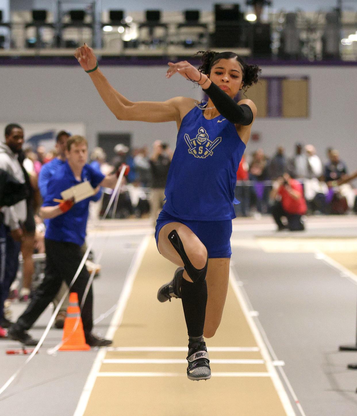 Webster Schroeder’s Corintia Griffith competes in the triple jump event.