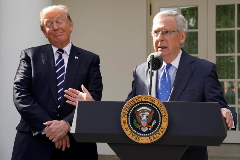 U.S. Senate Majority Leader Mitch McConnell speaks to the media with U.S. President Donald Trump at his side in the Rose Garden of the White House in Washington