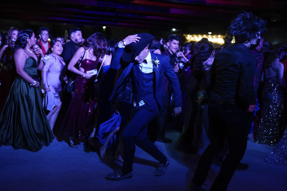 Young people dance during prom at the Grace Gardens Event Center in El Paso, Texas on Friday, May 7, 2021. Around 2,000 attended the outdoor event at the private venue after local school districts announced they would not host proms this year. Tickets cost $45. (AP Photo/Paul Ratje)