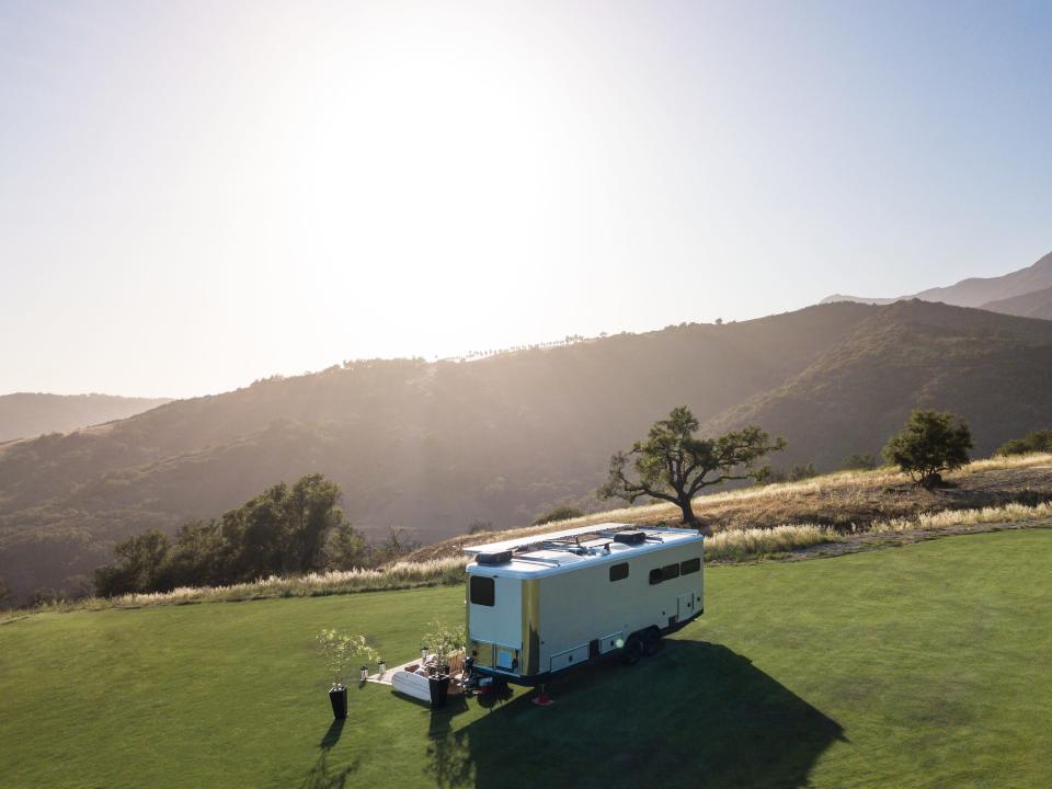 the 2022 Living Vehicle trailer outside on a patch of grass