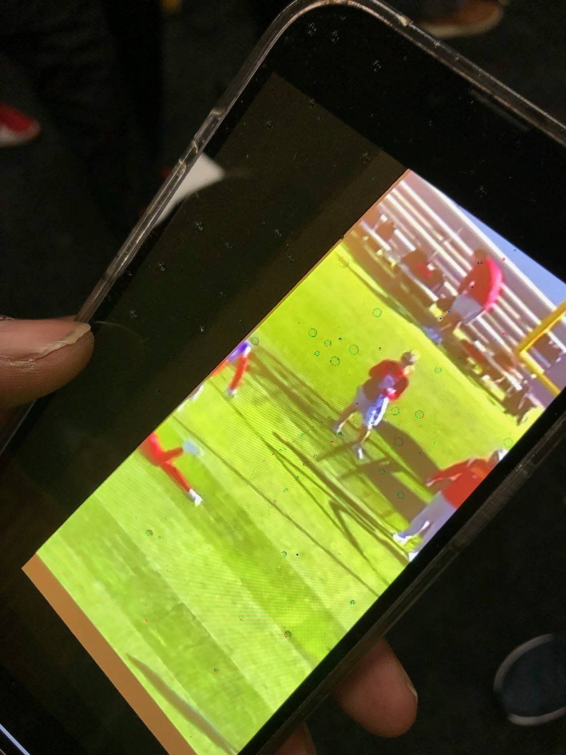 Kansas City Chiefs receiver Kadarius Toney shows a picture on his phone of him slipping — and only his legs showing on the team’s film — from a run-through of the Chiefs’ ”Shuttle Corn Dog” play at Thursday’s Super Bowl practice.