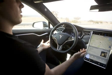 New Autopilot features are demonstrated in a Tesla Model S during a Tesla event in Palo Alto, California October 14, 2015. REUTERS/Beck Diefenbach