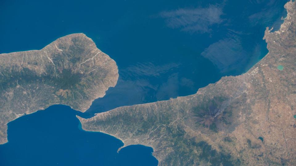 view from space sicily and italy land masses reach for each other across the ocean