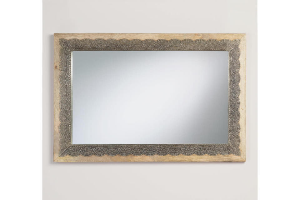 This rustic mirror has a charming, delicate heirloom quality to it.
